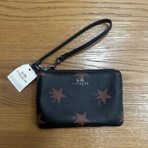 Coach wristlet NWT, Black with brown stars